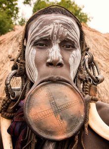A Mursi woman with a large lip plate, the people's famous adornment, in the Omo Valley.