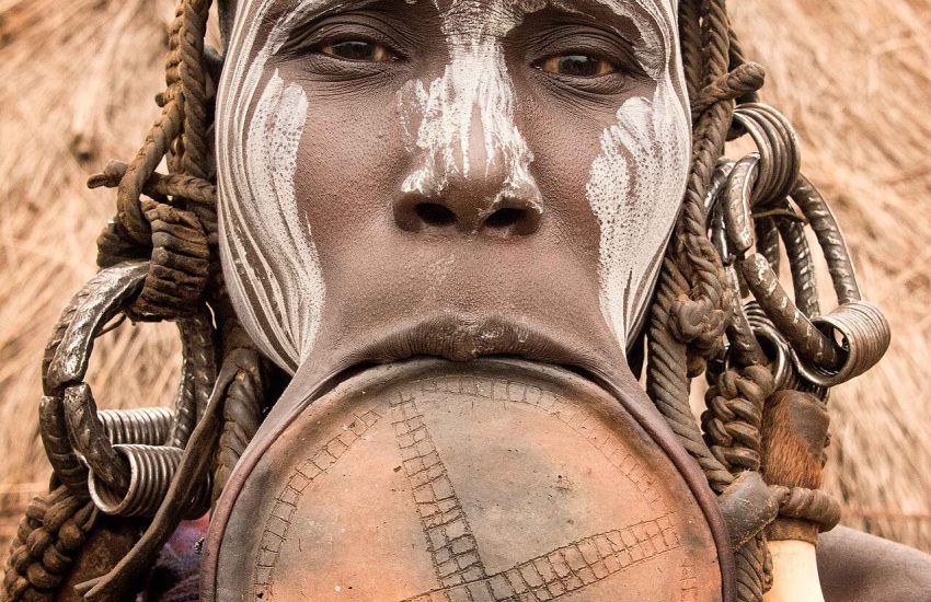 A Mursi woman with a large lip plate, the people's famous adornment, in the Omo Valley.