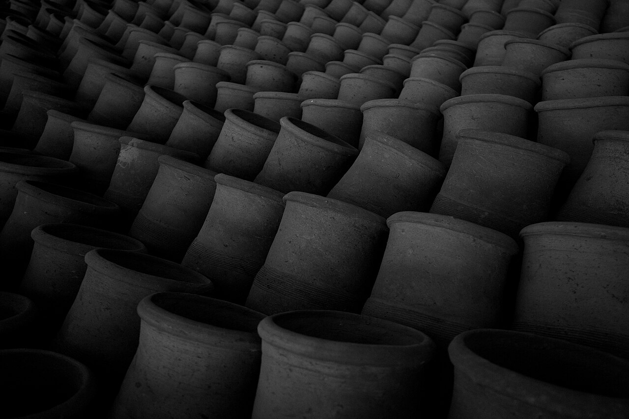 Clay pots stacked for sale in Sudan, part of the region's crafts.