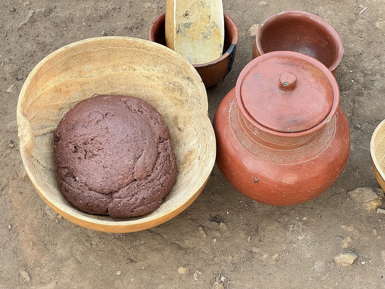 Sorghum served in a locally made plate, the staple grain of the Nuba.