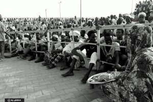 Spectators at a Nuba wrestling match, a great social gathering.
