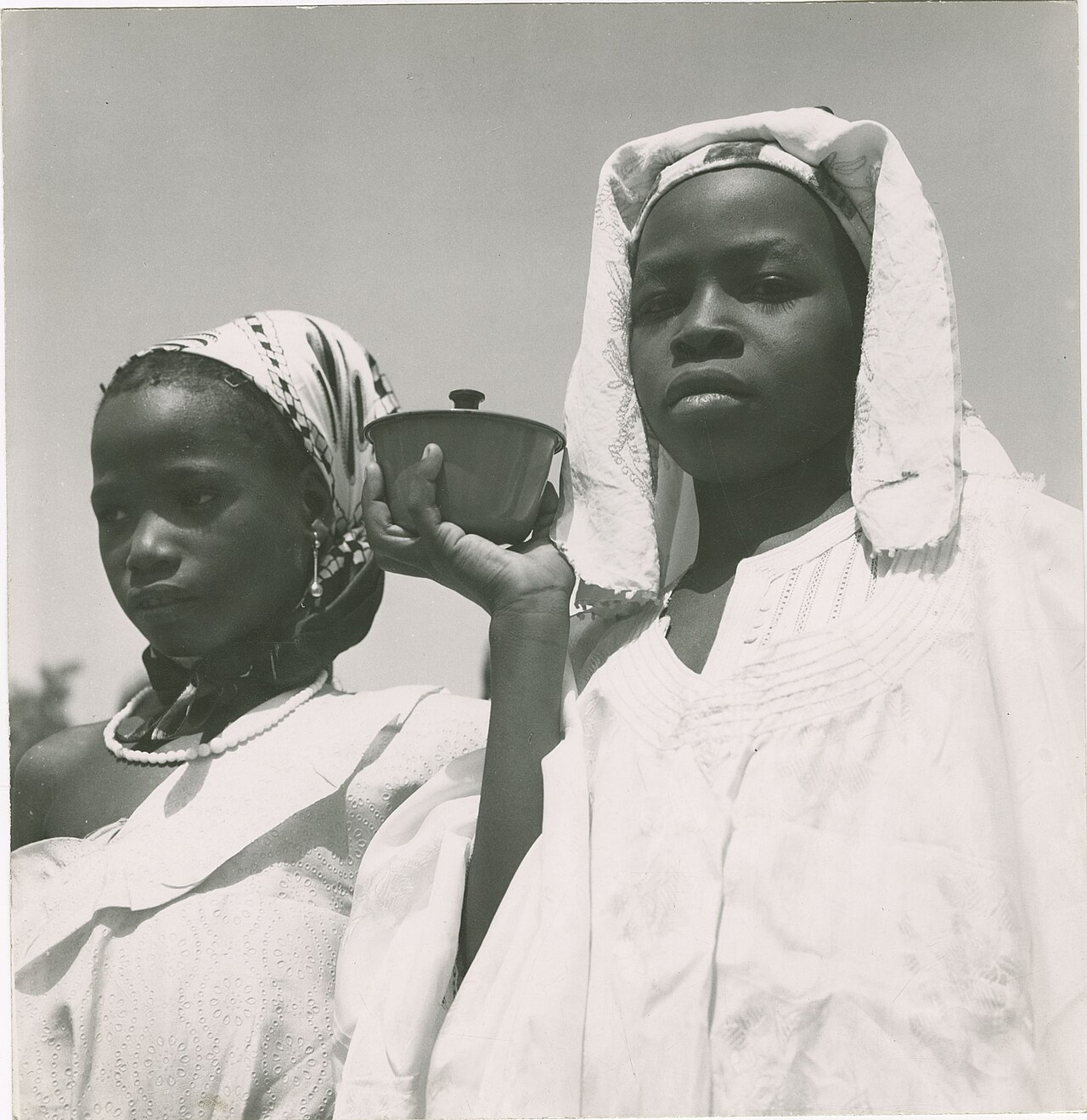Two Nupe girls in a 1960 photograph; the people speak the Nupe language.