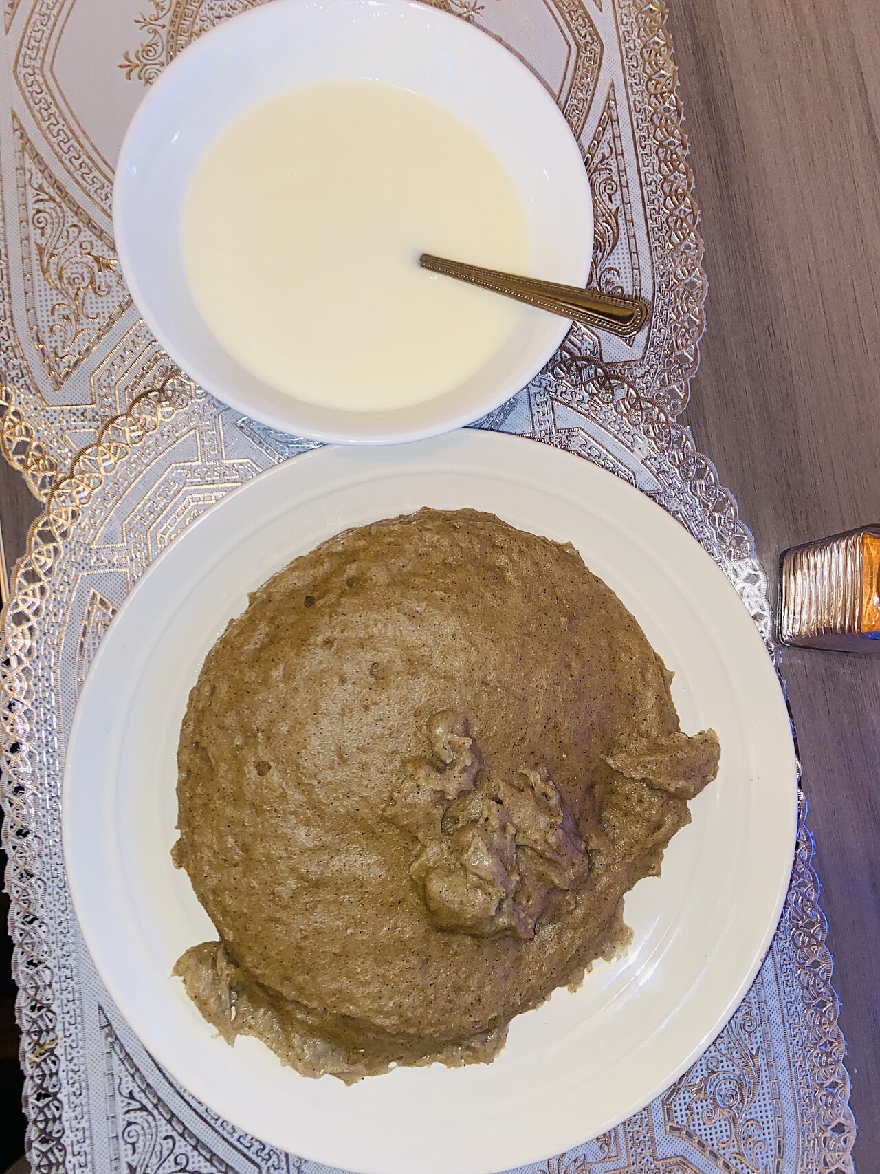 Mahangu porridge served with milk, the staple food of the Ovambo.