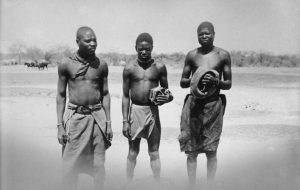 Ovambo men in a historic photograph; the people speak Oshiwambo.