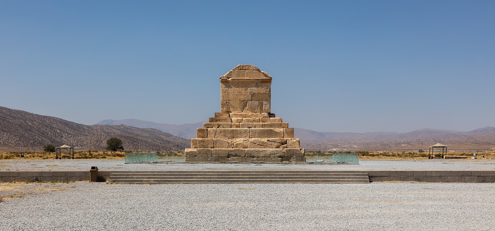 The ruins of Pasargadae spread across a high plain in Iran.