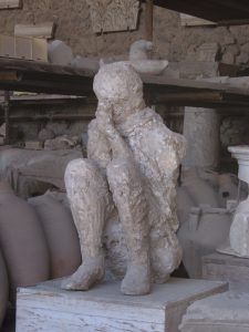 Plaster casts of victims of the eruption, captured in their final moments at Pompeii.