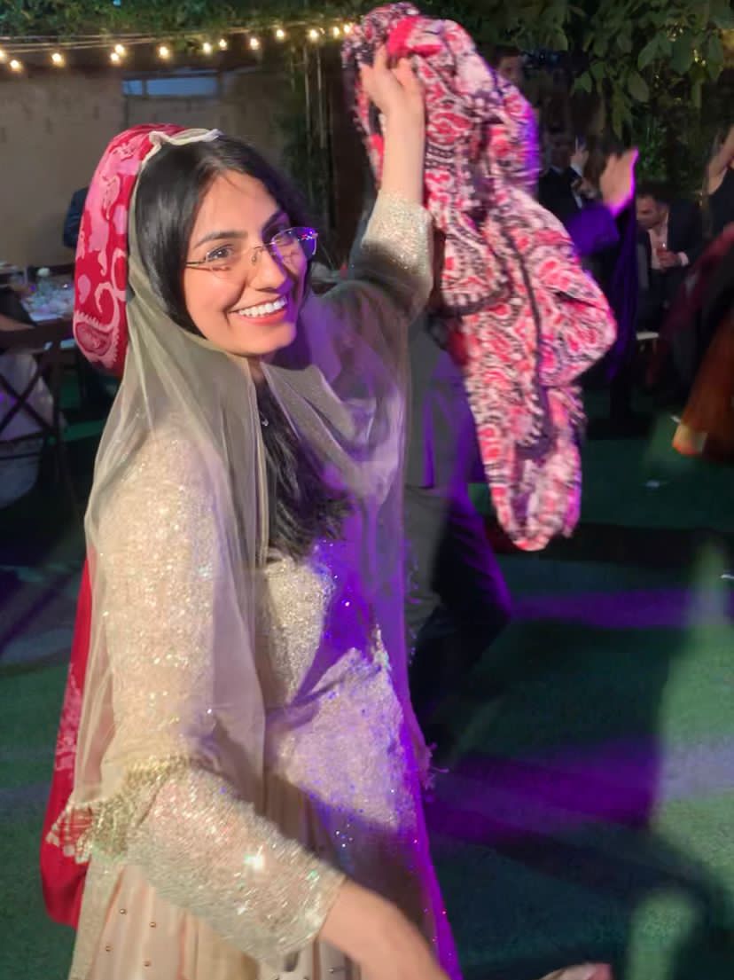 A woman dancing at a Qashqai wedding celebration.