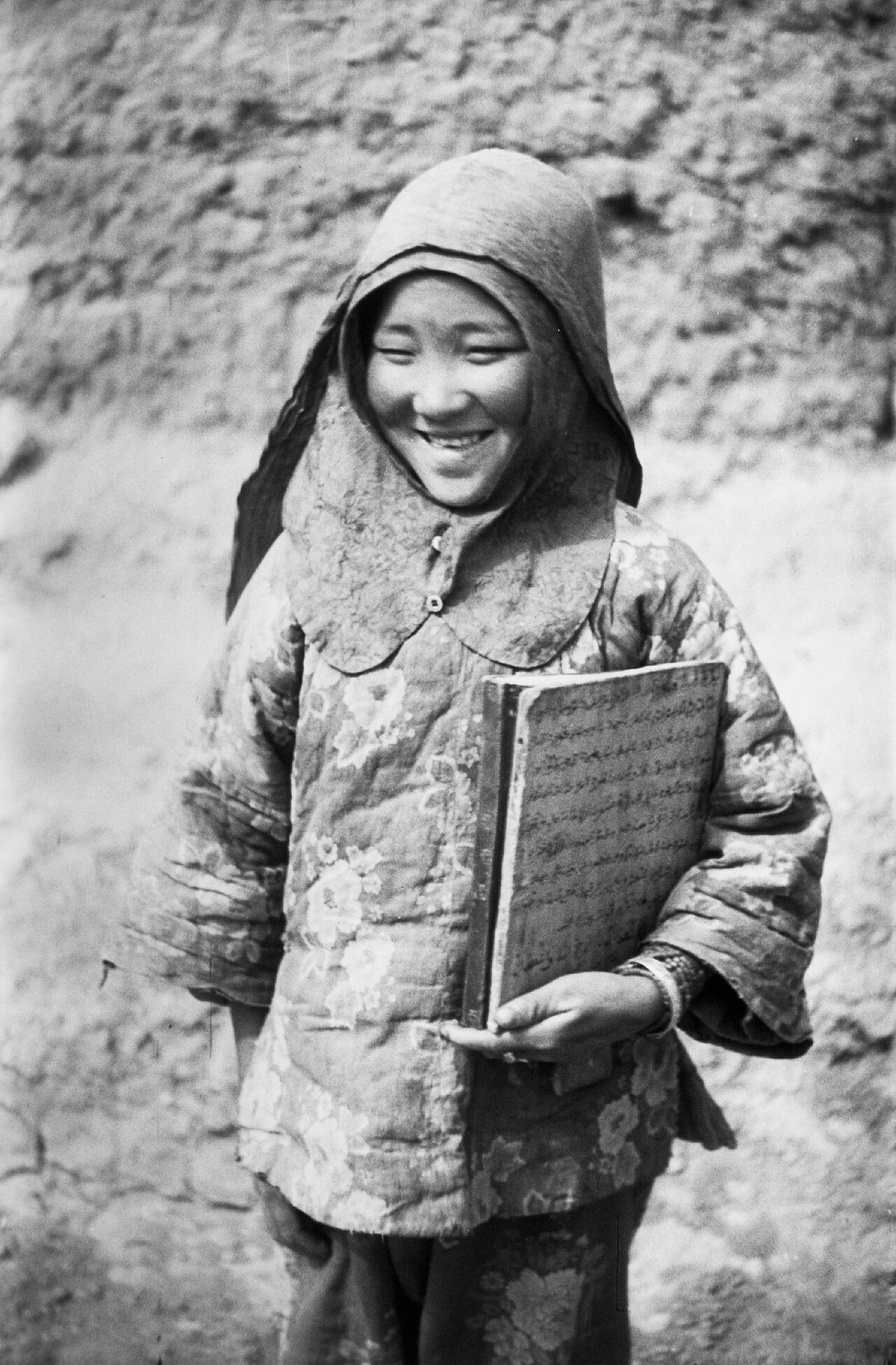 A Salar girl with Quranic verses in Arabic