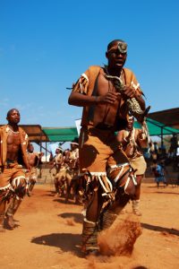 A San dance around the fire, at the heart of communal and healing life.