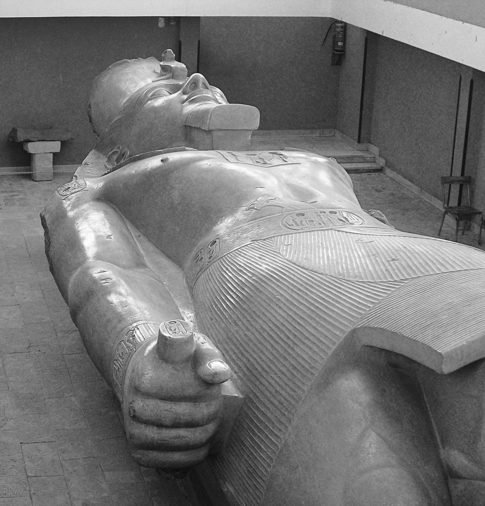 A fallen colossal statue of Ramesses II at ancient Memphis.
