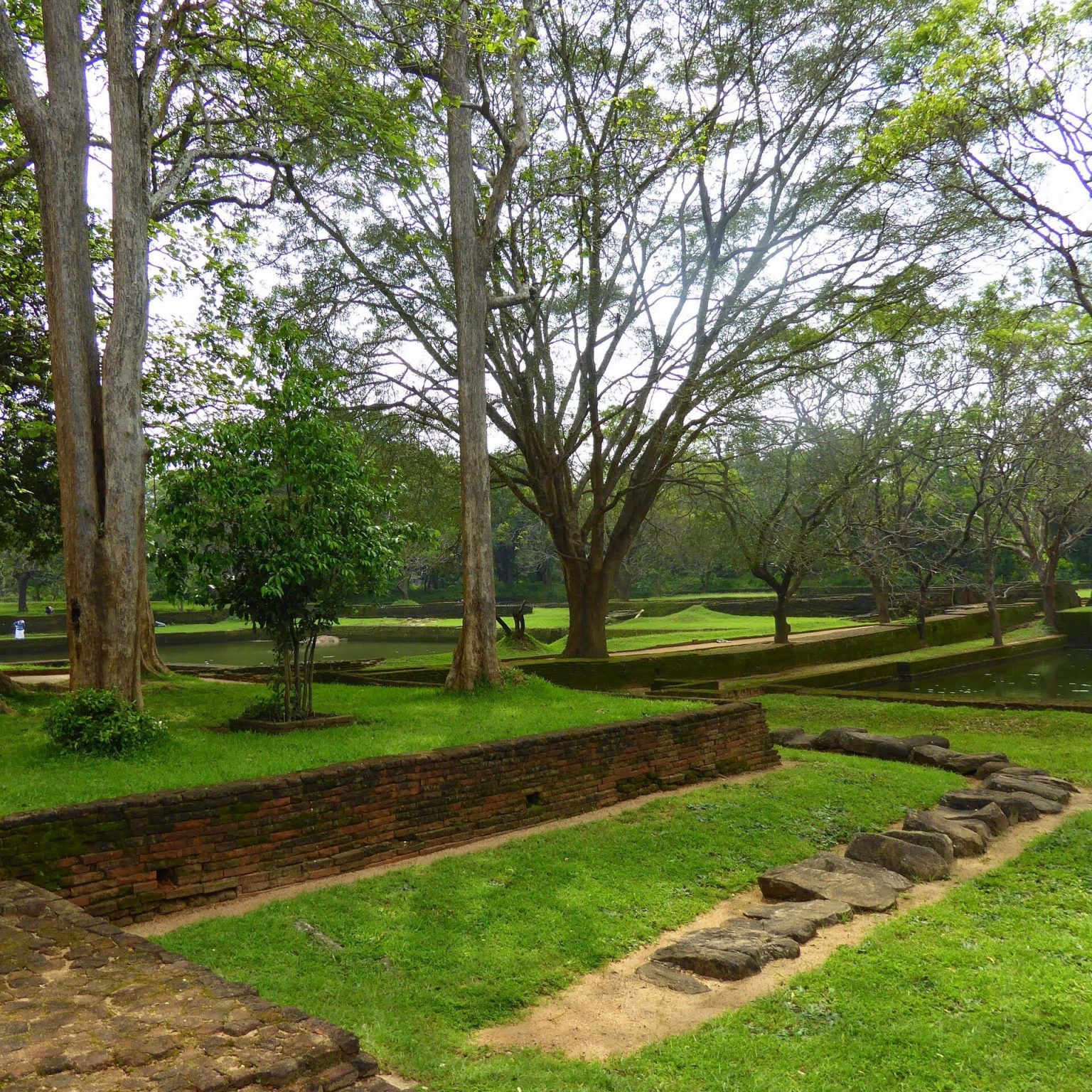 The symmetrical water gardens at the foot of the Sigiriya rock. – InKend