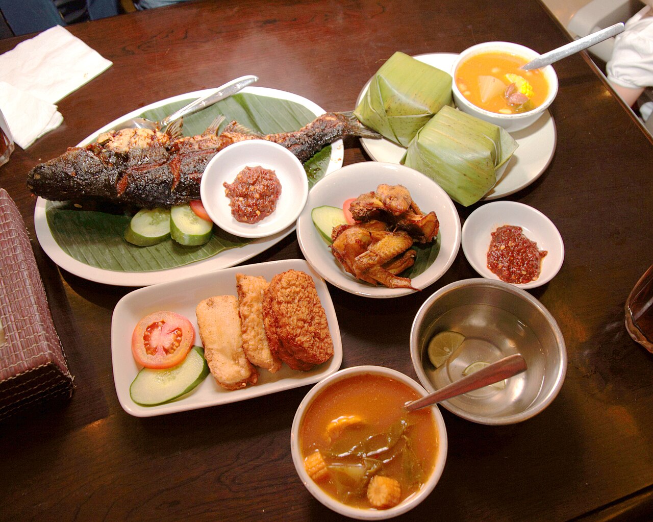 A spread of Sundanese food with rice and fresh vegetables