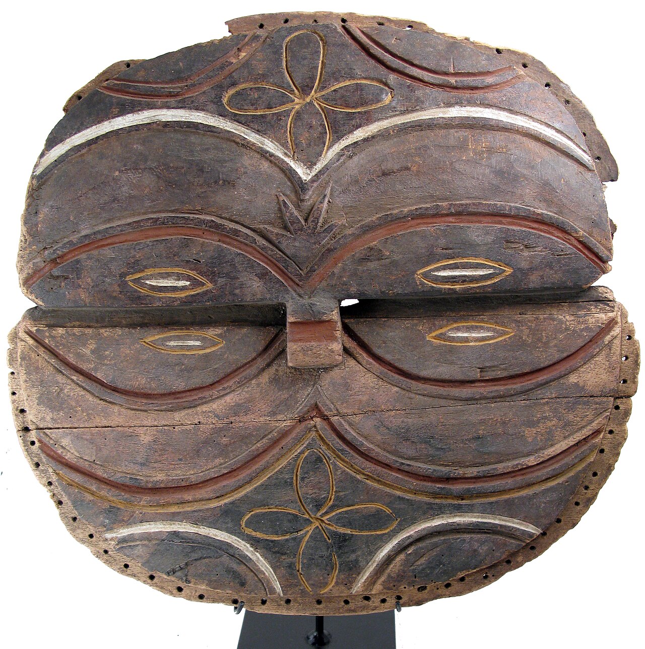 A Teke circular mask of the kind worn in the Kidumu dance.