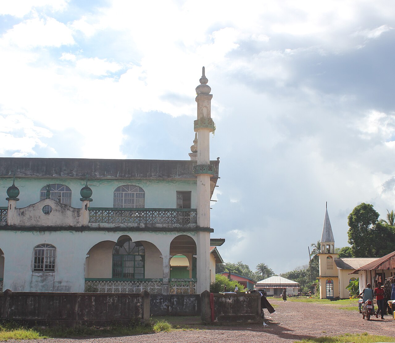 A mosque beside a church in Sierra Leone; most Temne are Muslim.