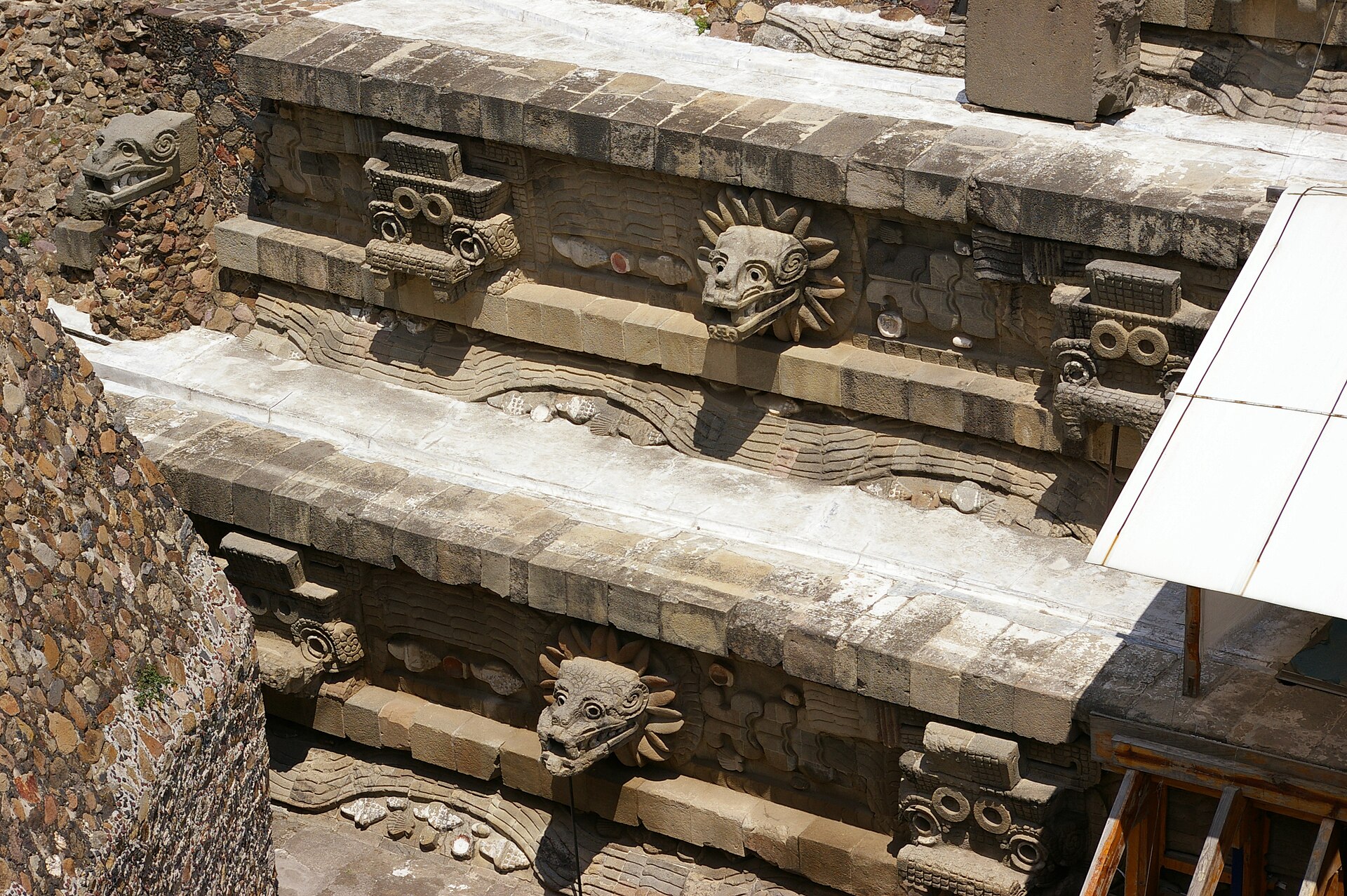 The Temple of the Feathered Serpent, adorned with carved heads of the plumed serpent deity