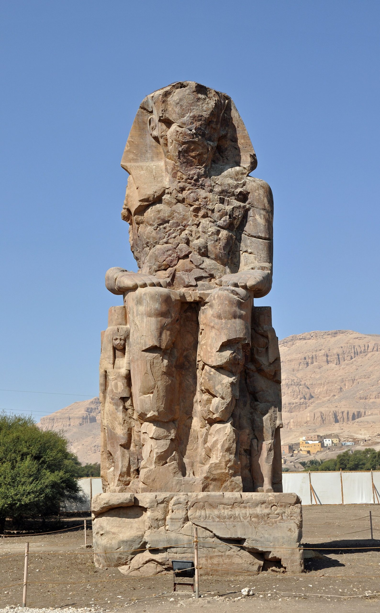 The Colossi of Memnon, twin statues of Amenhotep III that once guarded his lost mortuary temple.