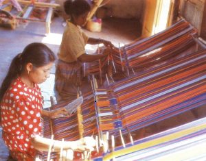 Weaving tais, the traditional cloth of Timor, at Lospalos