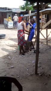 Pounding boiled yam into pounded yam, a favourite Tiv food.