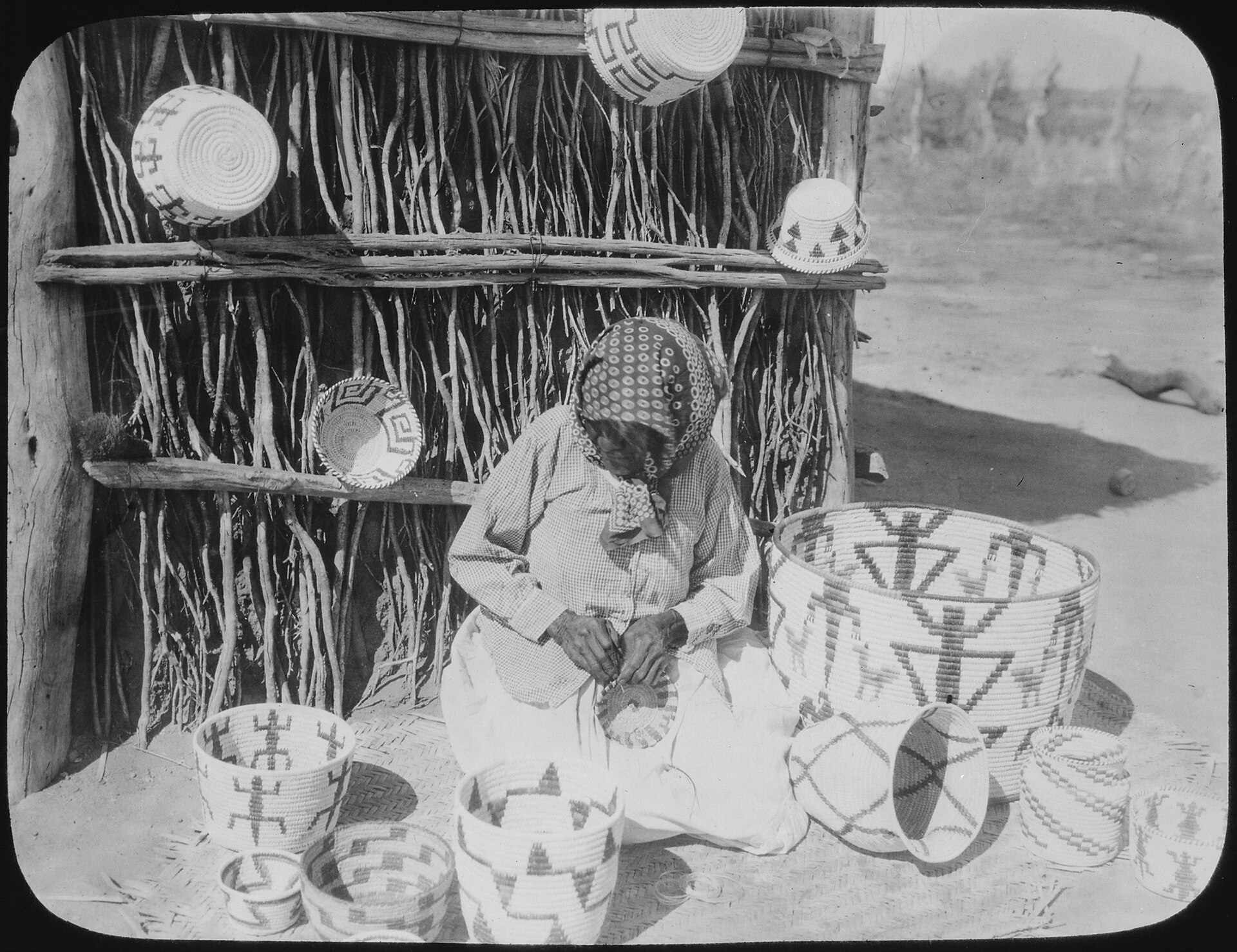 A Tohono O'odham basketmaker at work; the people are renowned weavers.