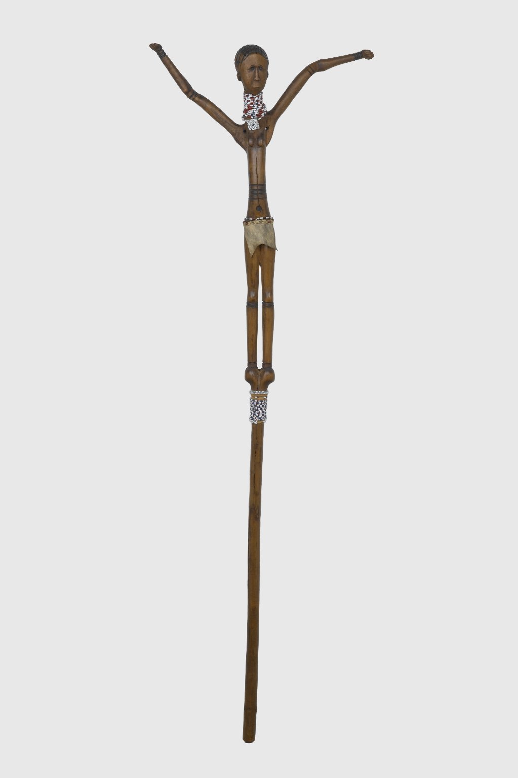 A carved Tsonga staff with a female figure, an example of the people's art.