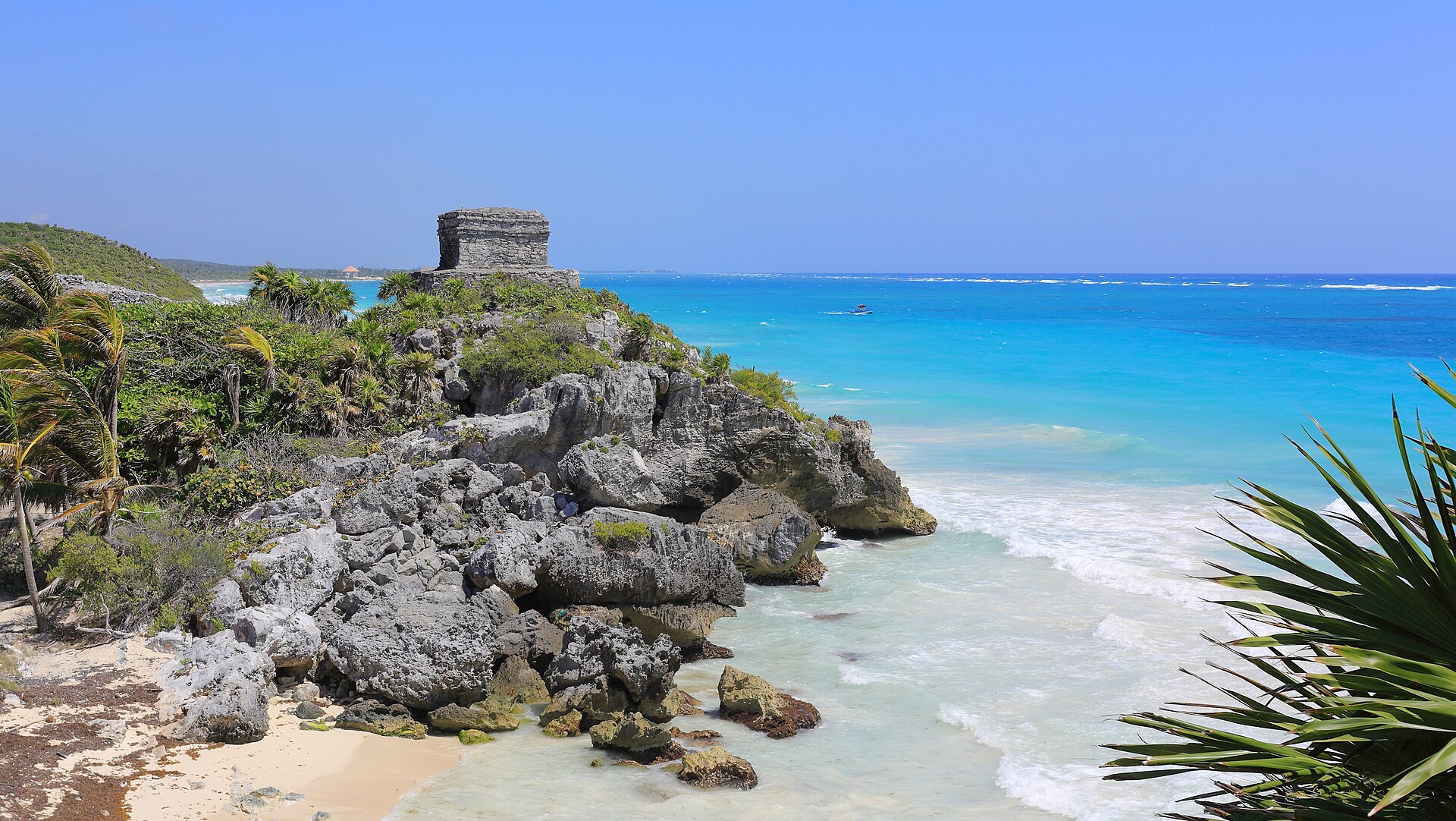 The defensive wall that gave Tulum its name, enclosing the Maya town.