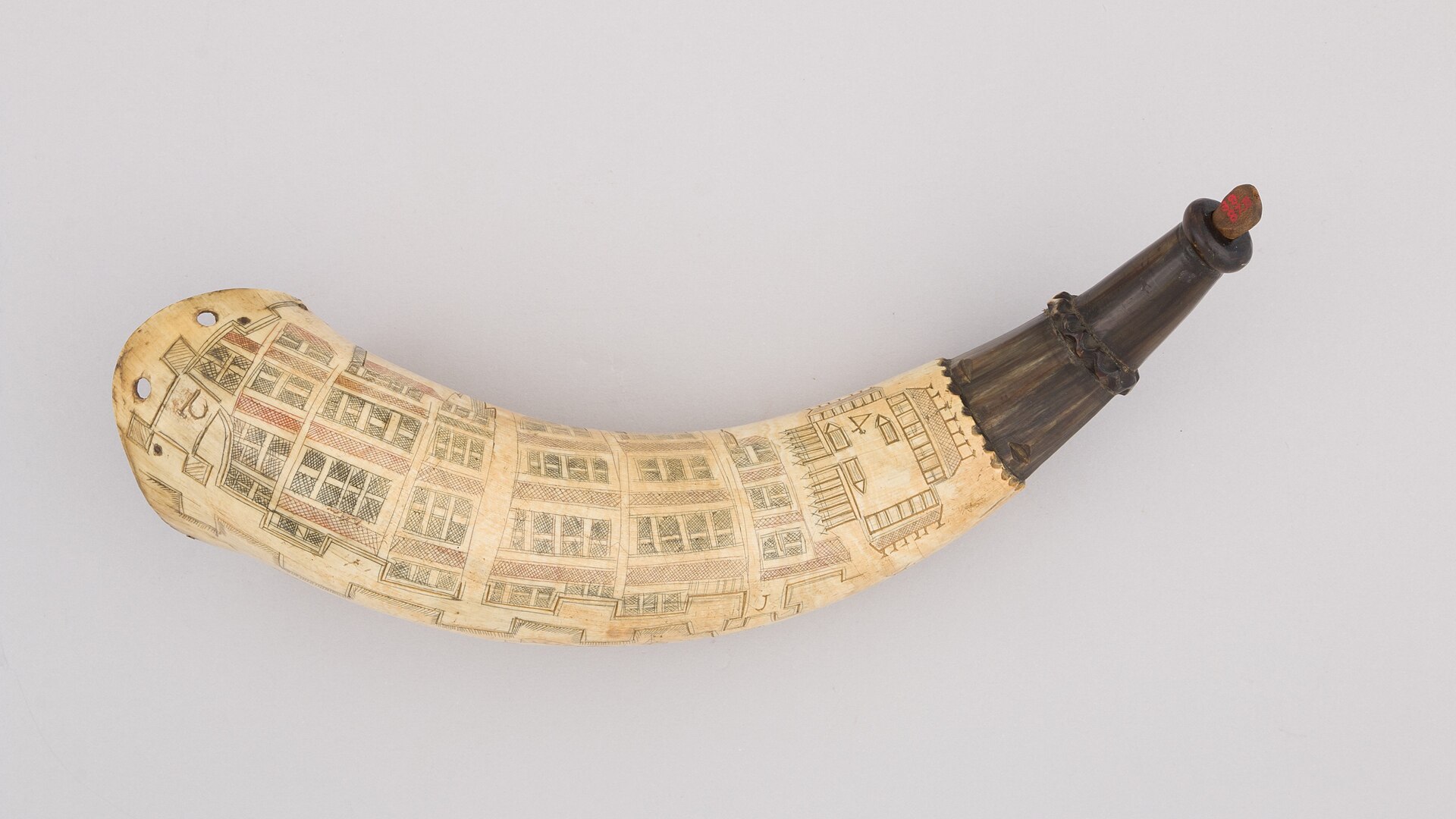 A wampum shoulder belt; wampum beads were made from quahog shells.