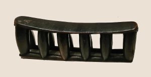 A carved Zulu headrest