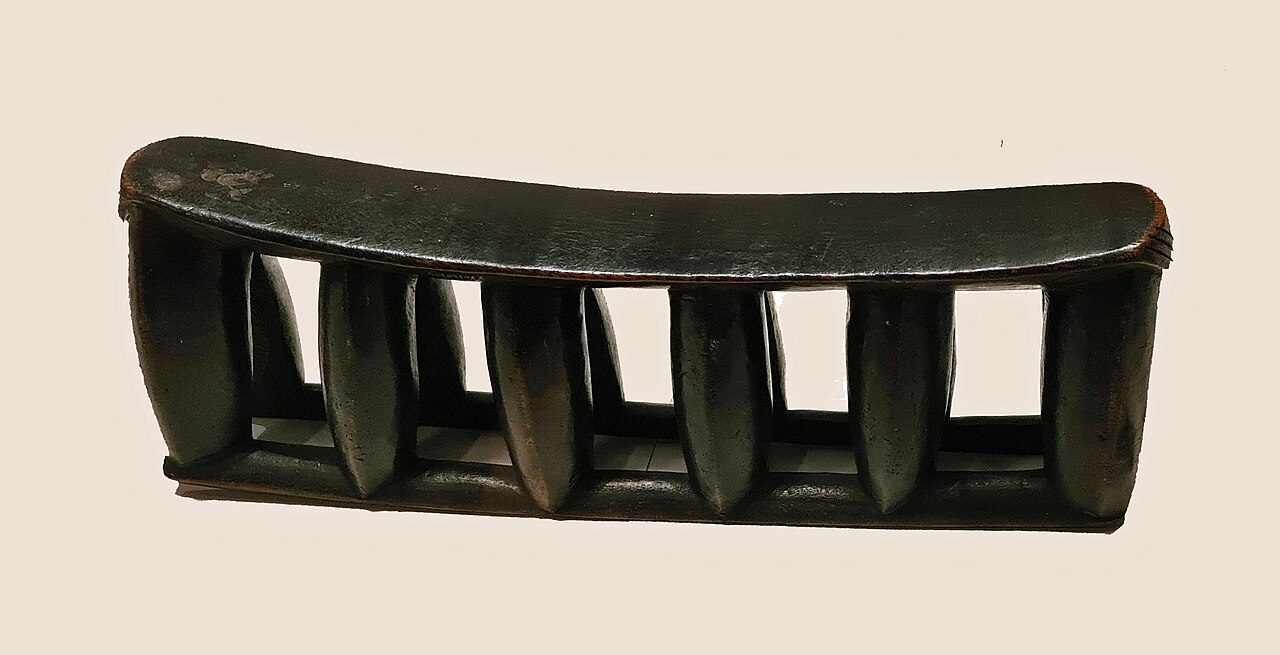 A carved Zulu headrest