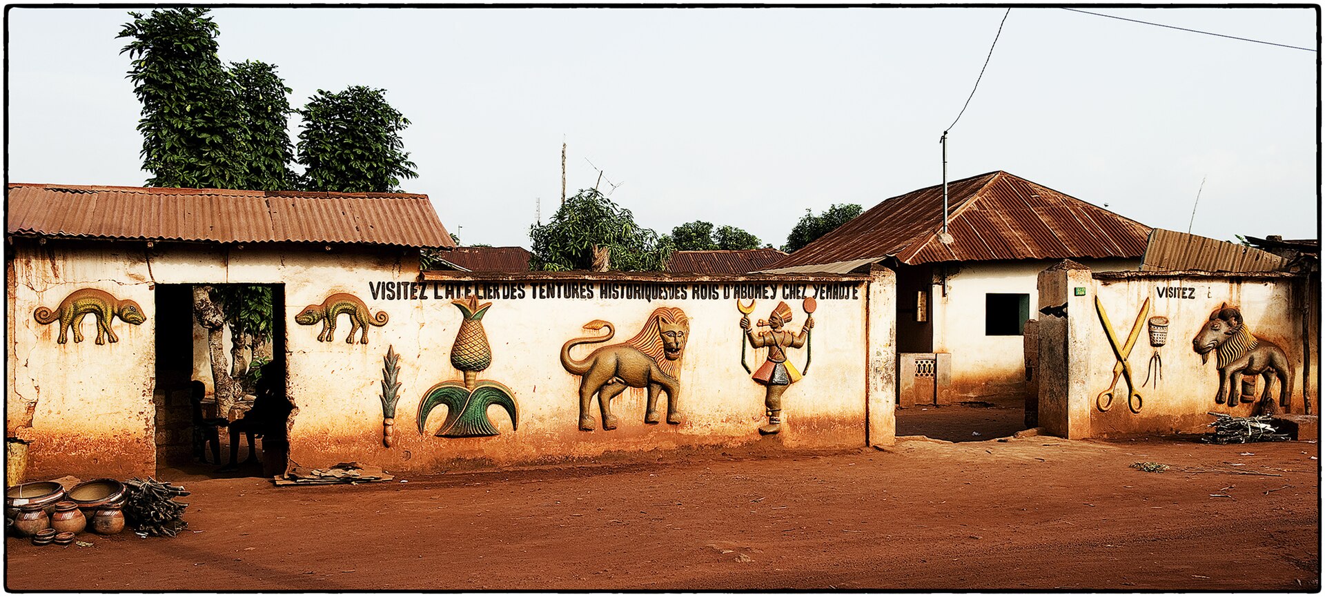 A wall of the royal palace, its packed clay surface a canvas for the art of Dahomey.
