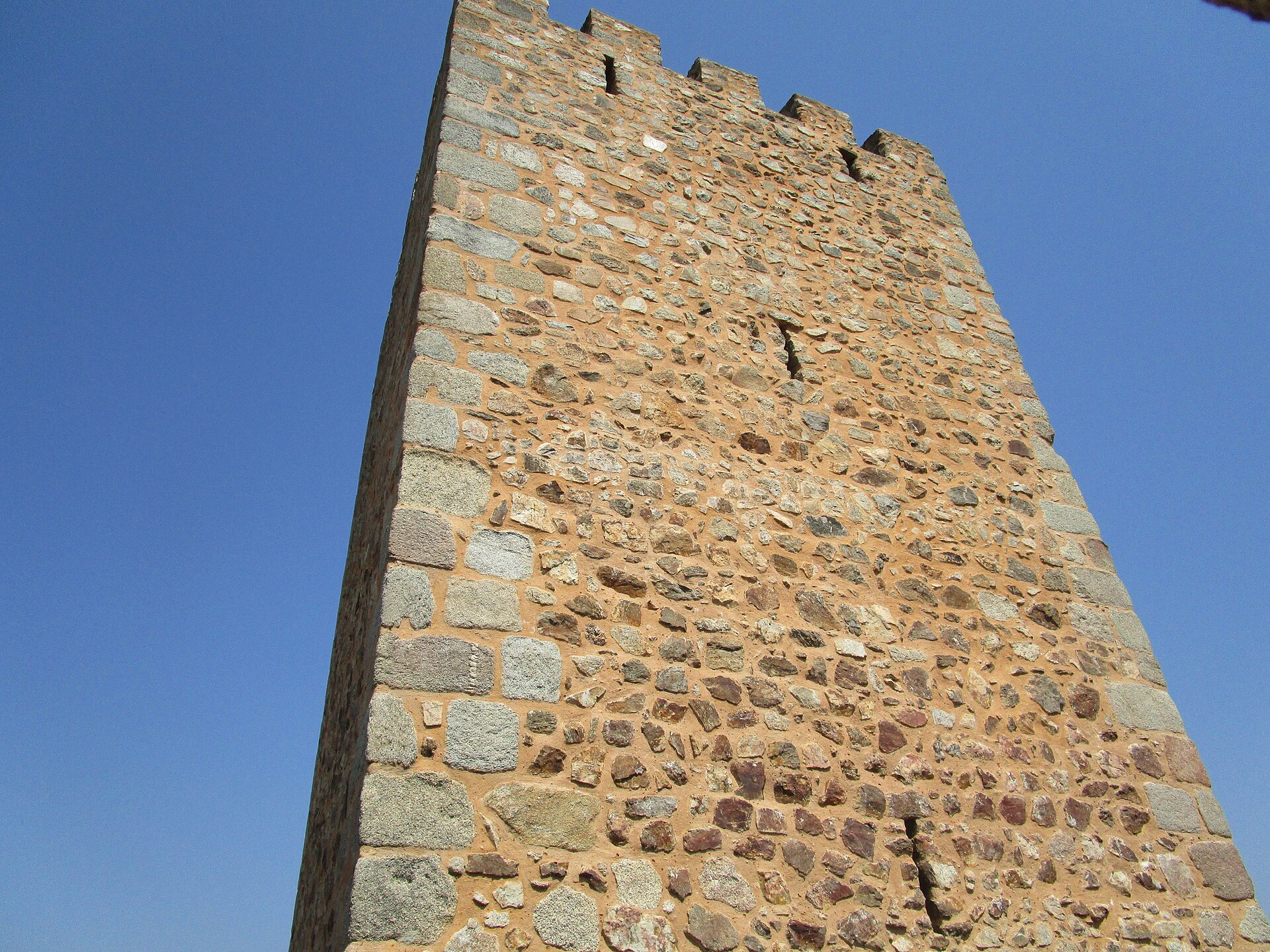 A tall central keep rises from the heart of the island fortress.