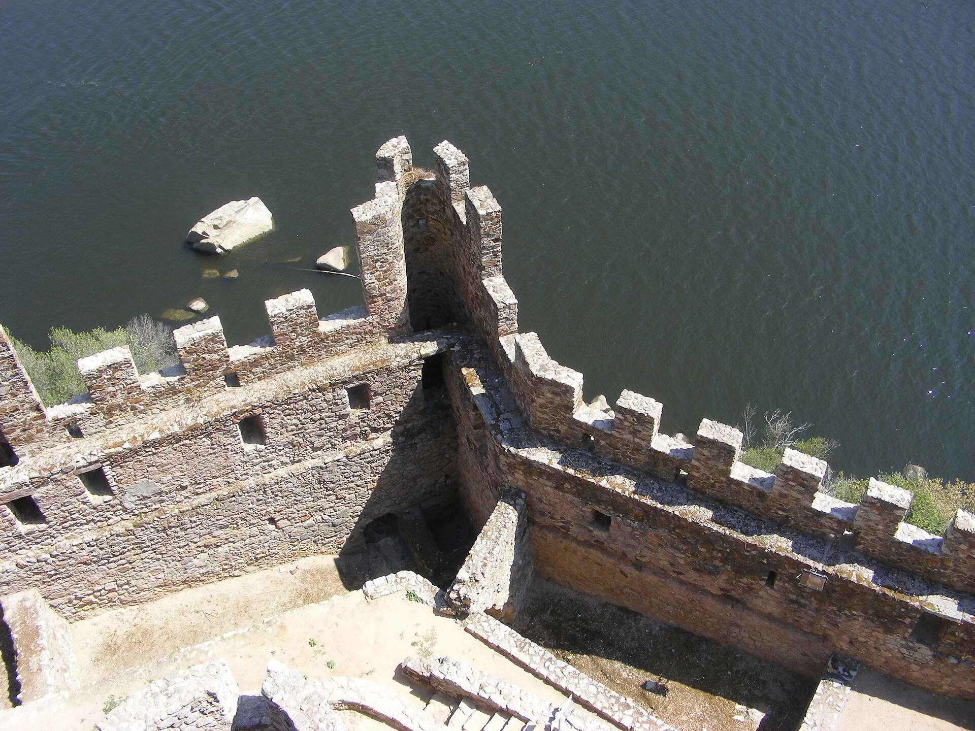 Battlemented walls studded with round towers ring the island.