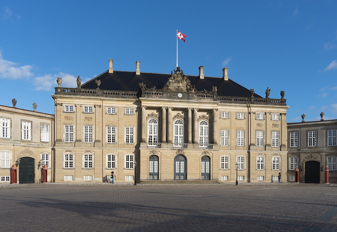 One of the four palaces of Amalienborg, with the royal statue.