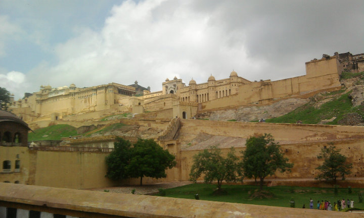 Amber Fort rises on a hill above the Maota Lake, built of red sandstone and white marble.