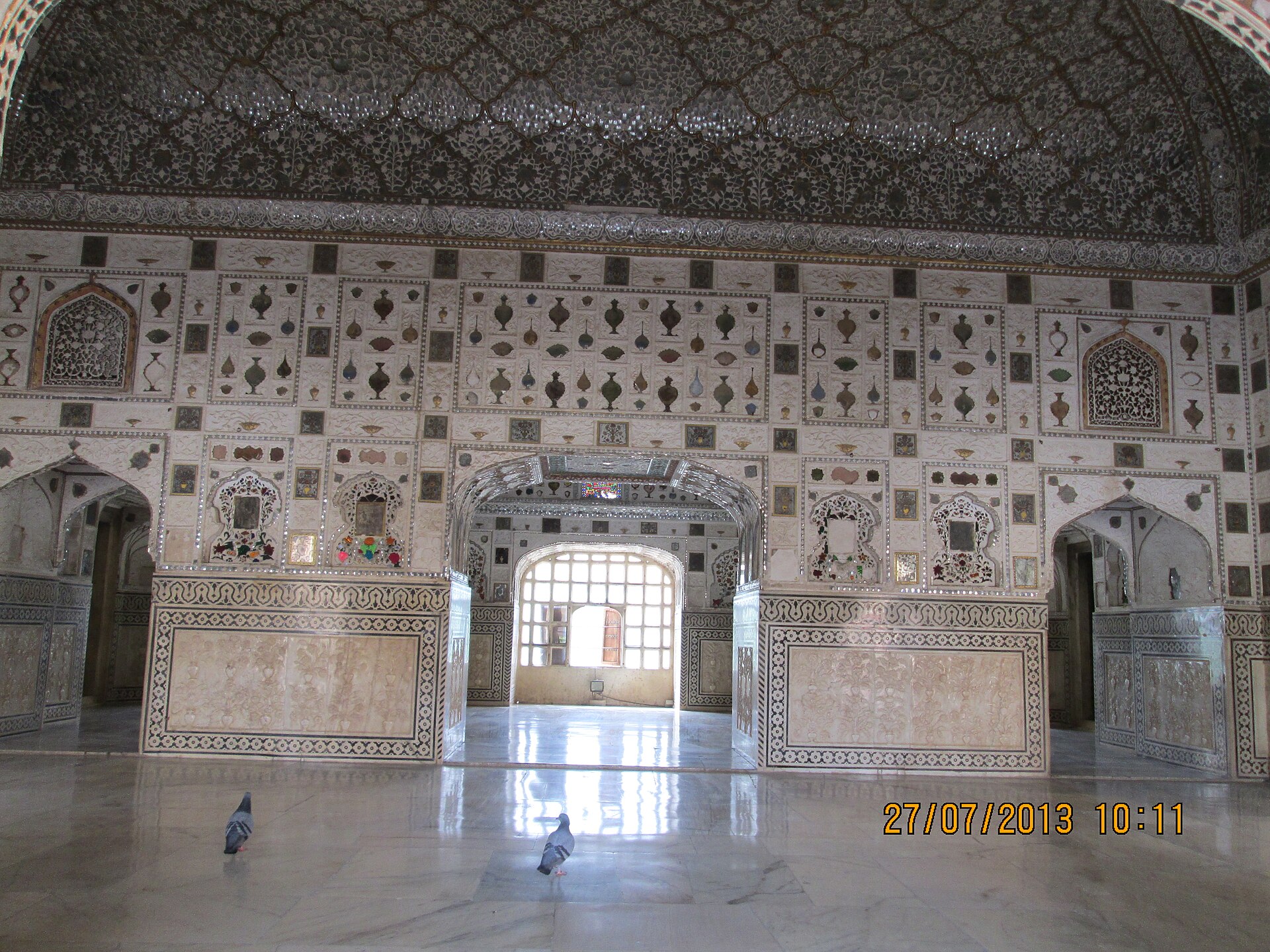 The Sheesh Mahal is inlaid with thousands of tiny mirrors that glitter in the candlelight.