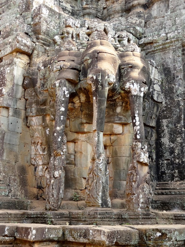 Visitors exploring the ancient monuments of Angkor Thom today