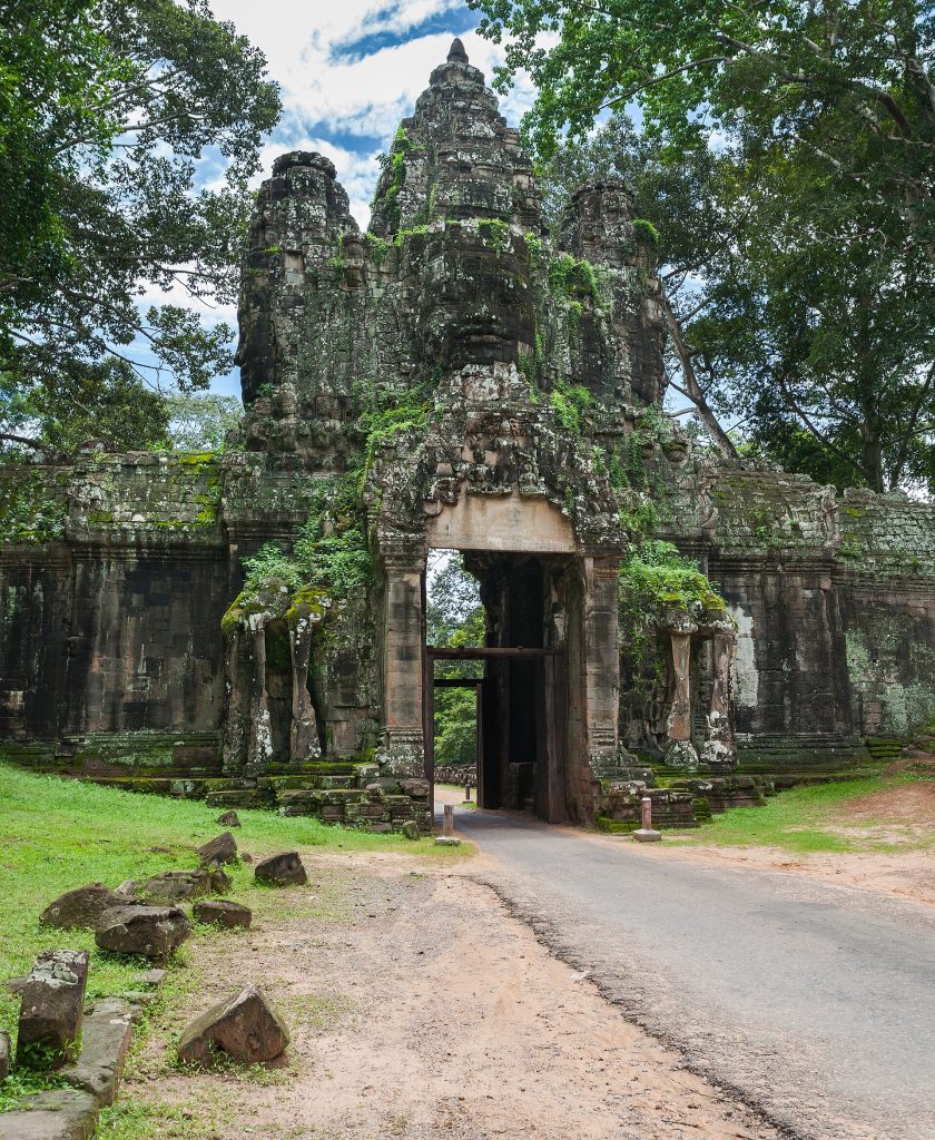 The Bayon temple, its towers crowded with serene stone faces