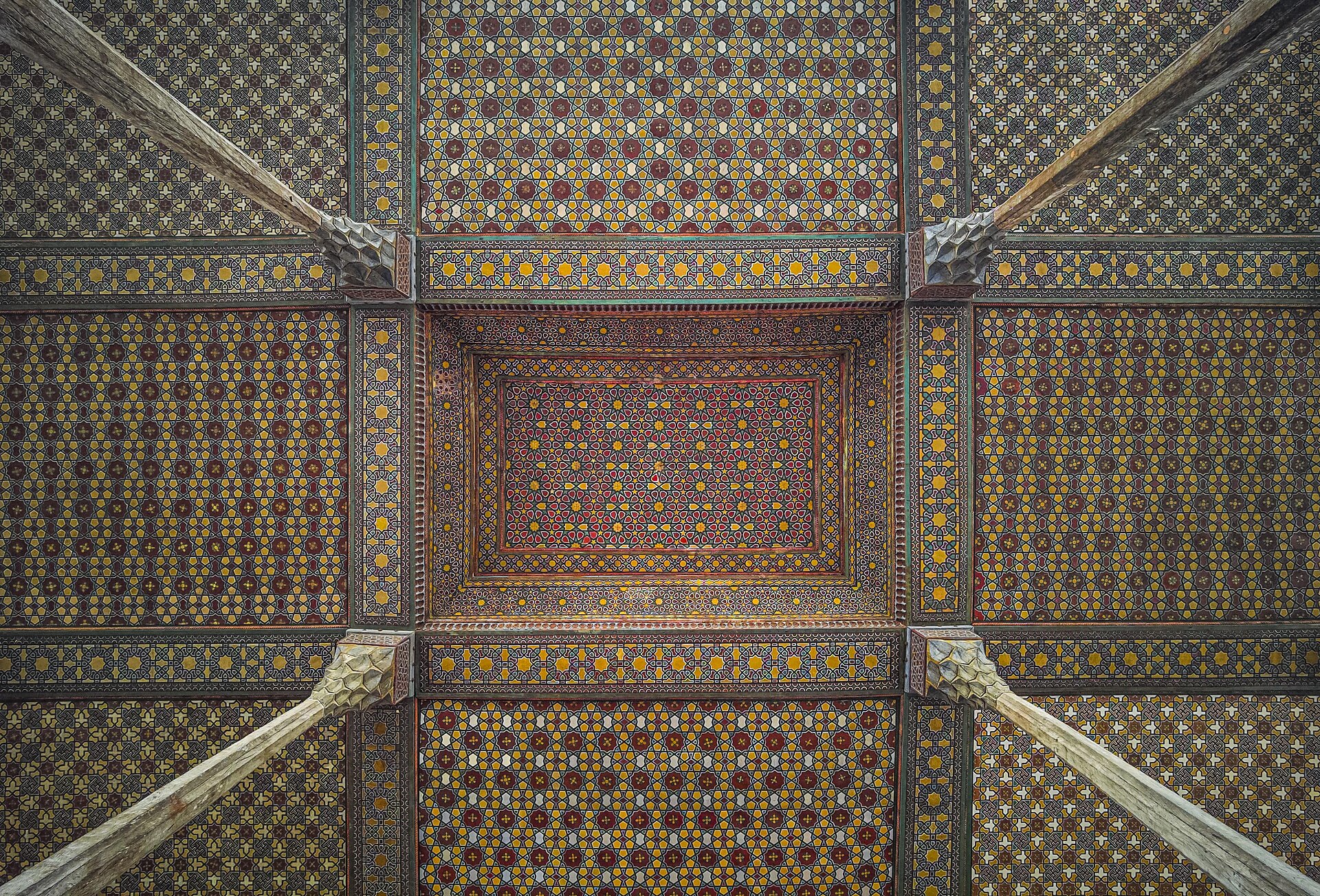 The decorated ceiling of the terrace, a masterpiece of painted woodwork.
