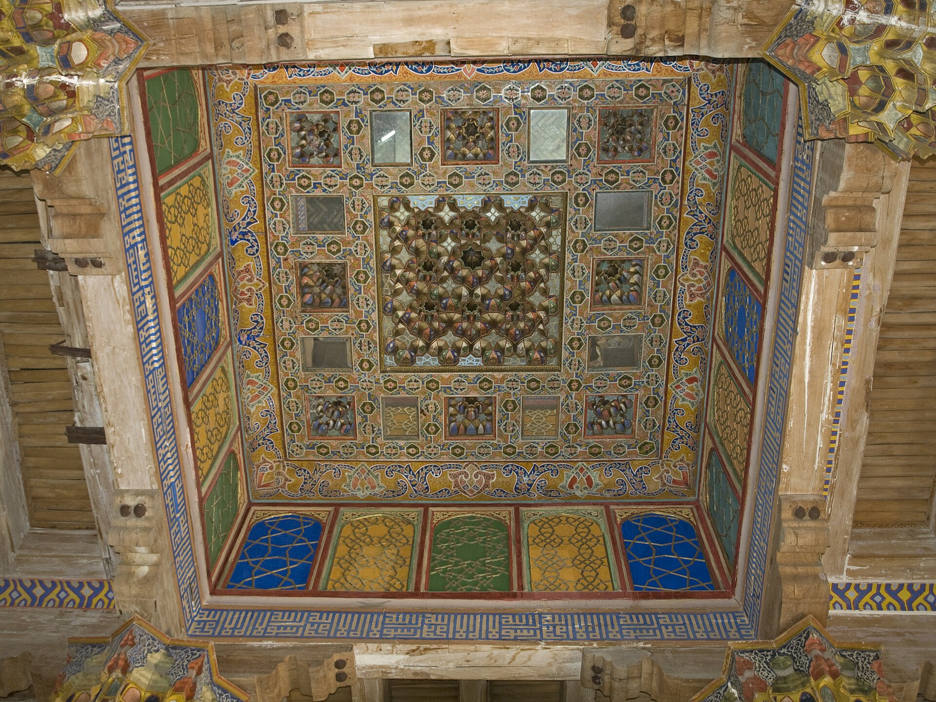 The carved and painted ceiling of the court mosque