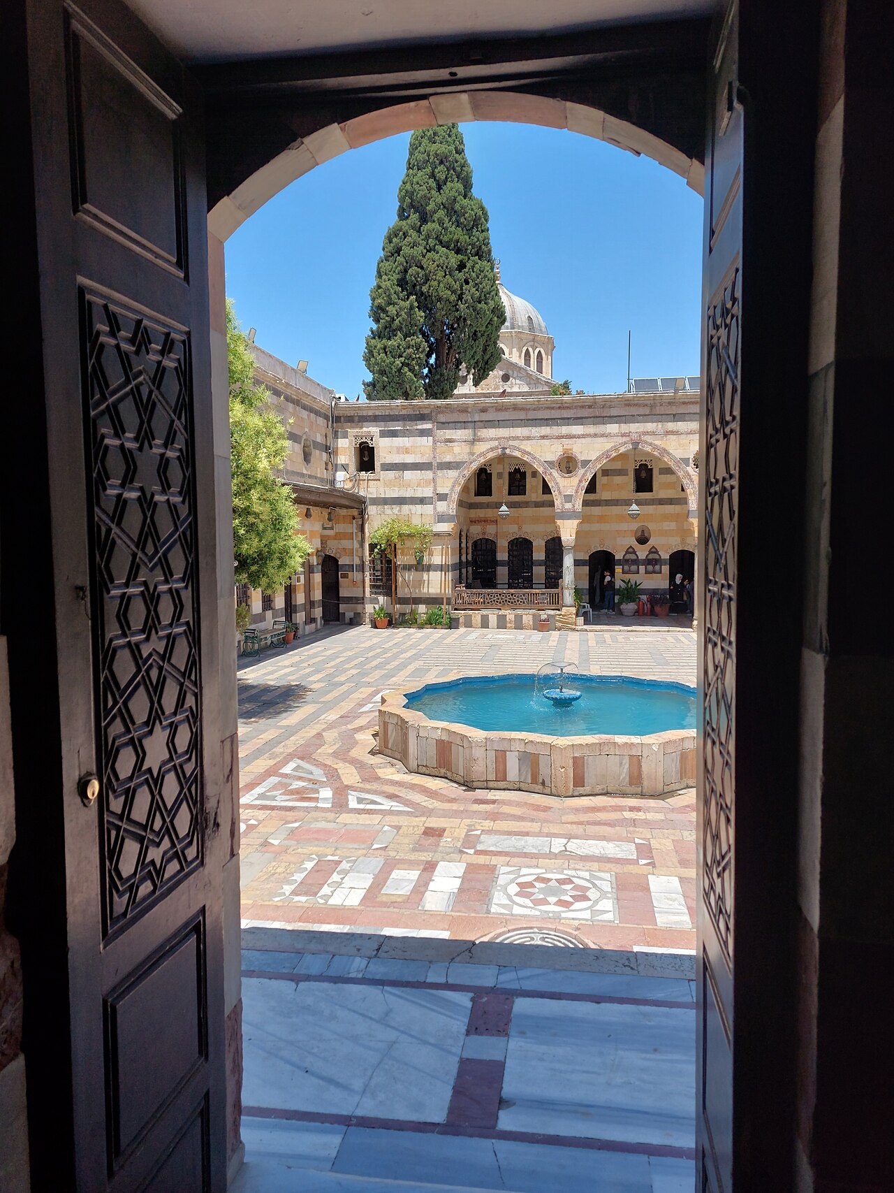 A fountain and pool in the palace courtyard.