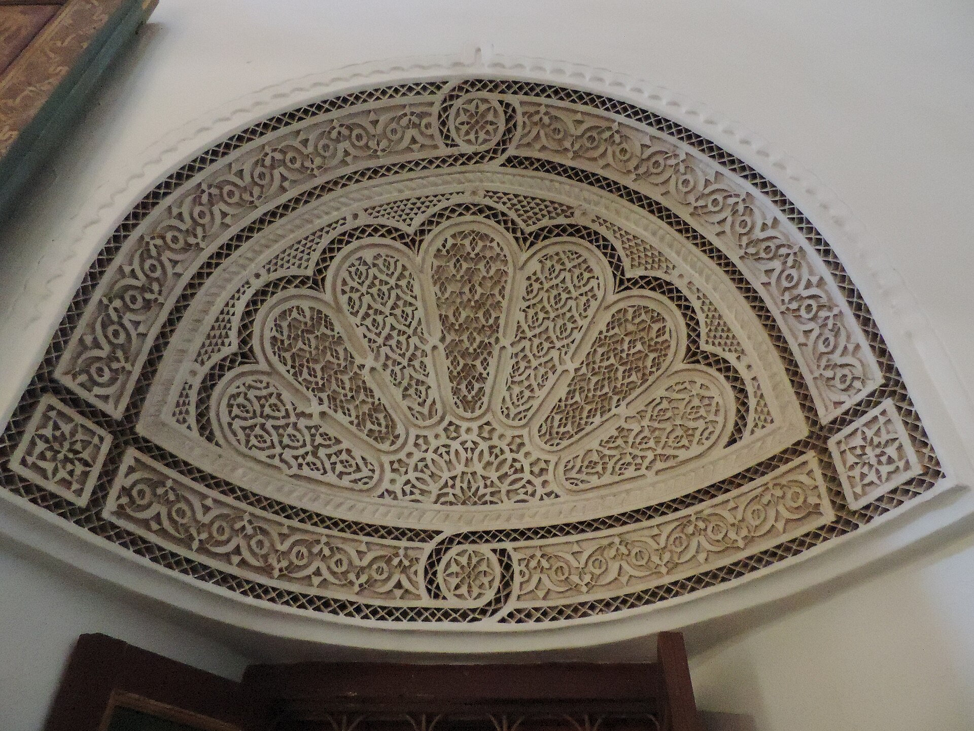 A vaulted and decorated space of the palace, showing the richness of Moroccan craft.