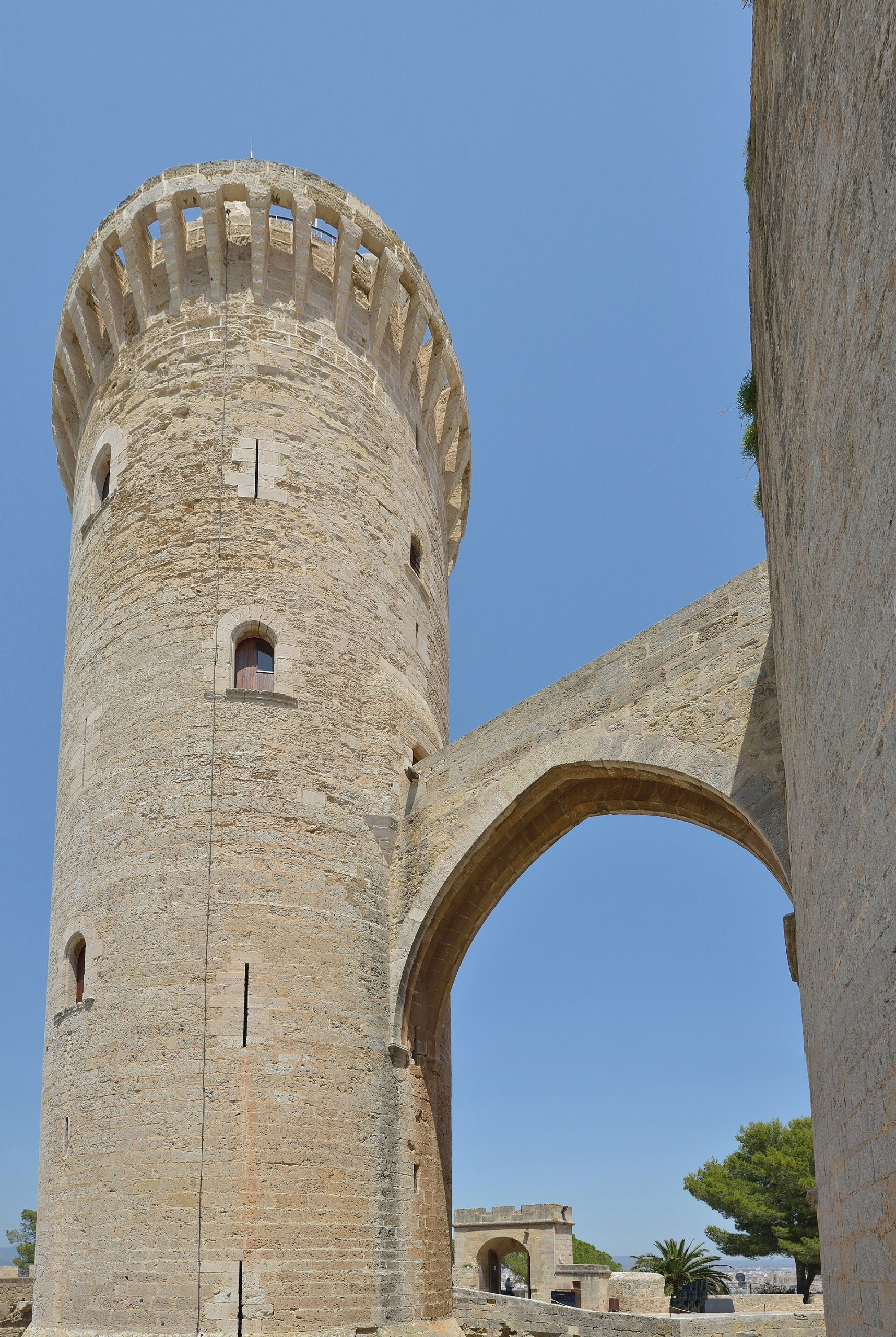 Three round towers stand at intervals along the circular wall.