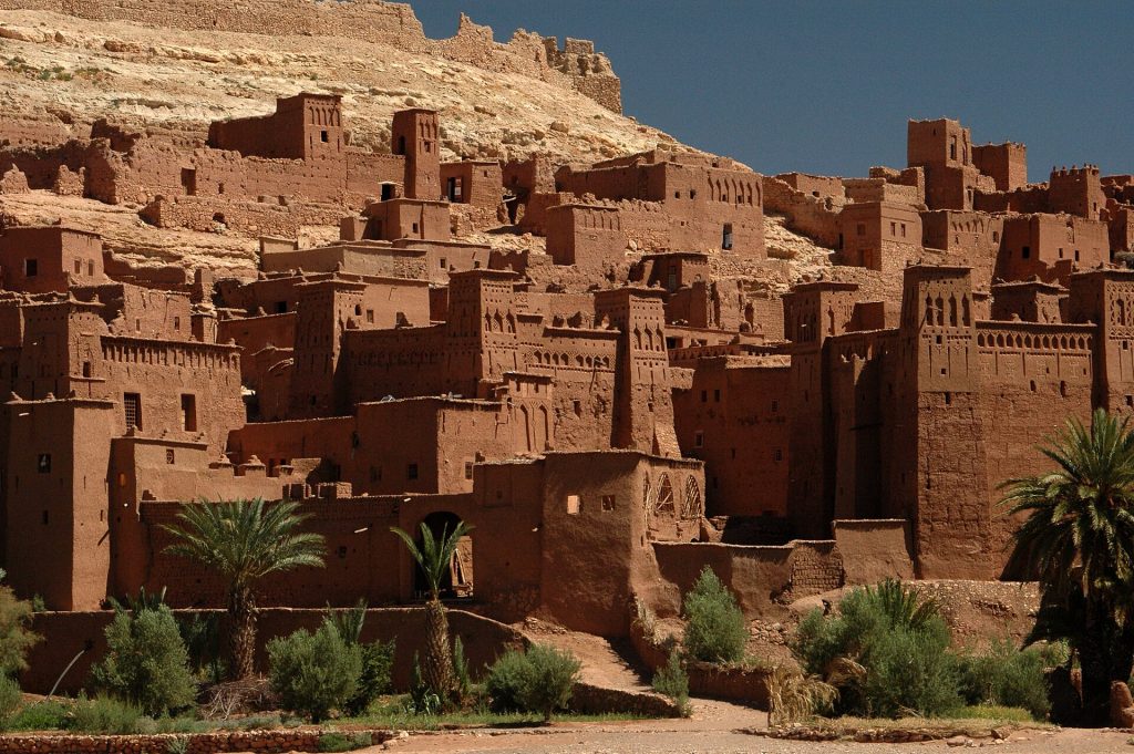 Visitors exploring the earthen village of Aït Benhaddou today
