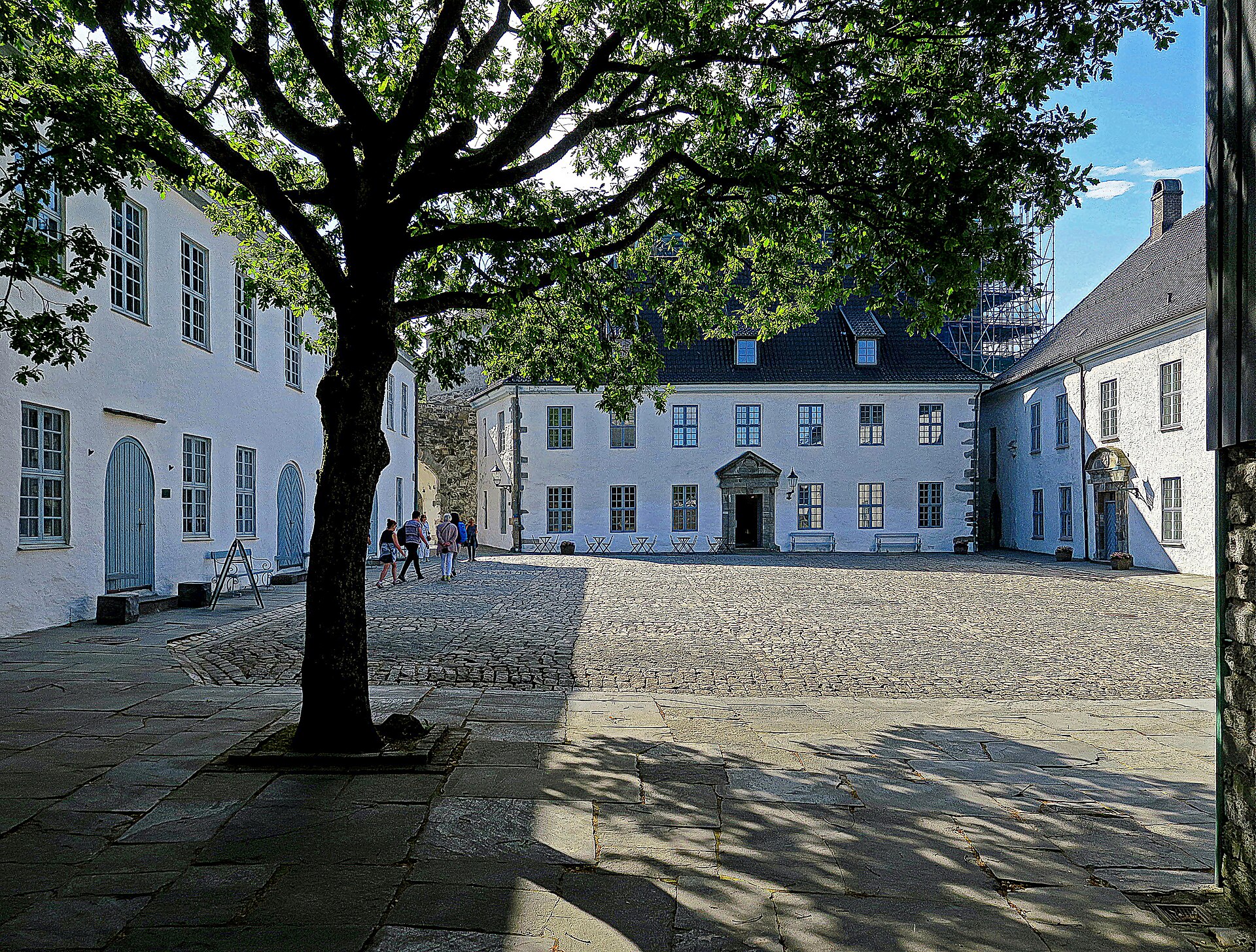 Ramparts, gates, and courtyards bind the medieval buildings into a single stronghold.