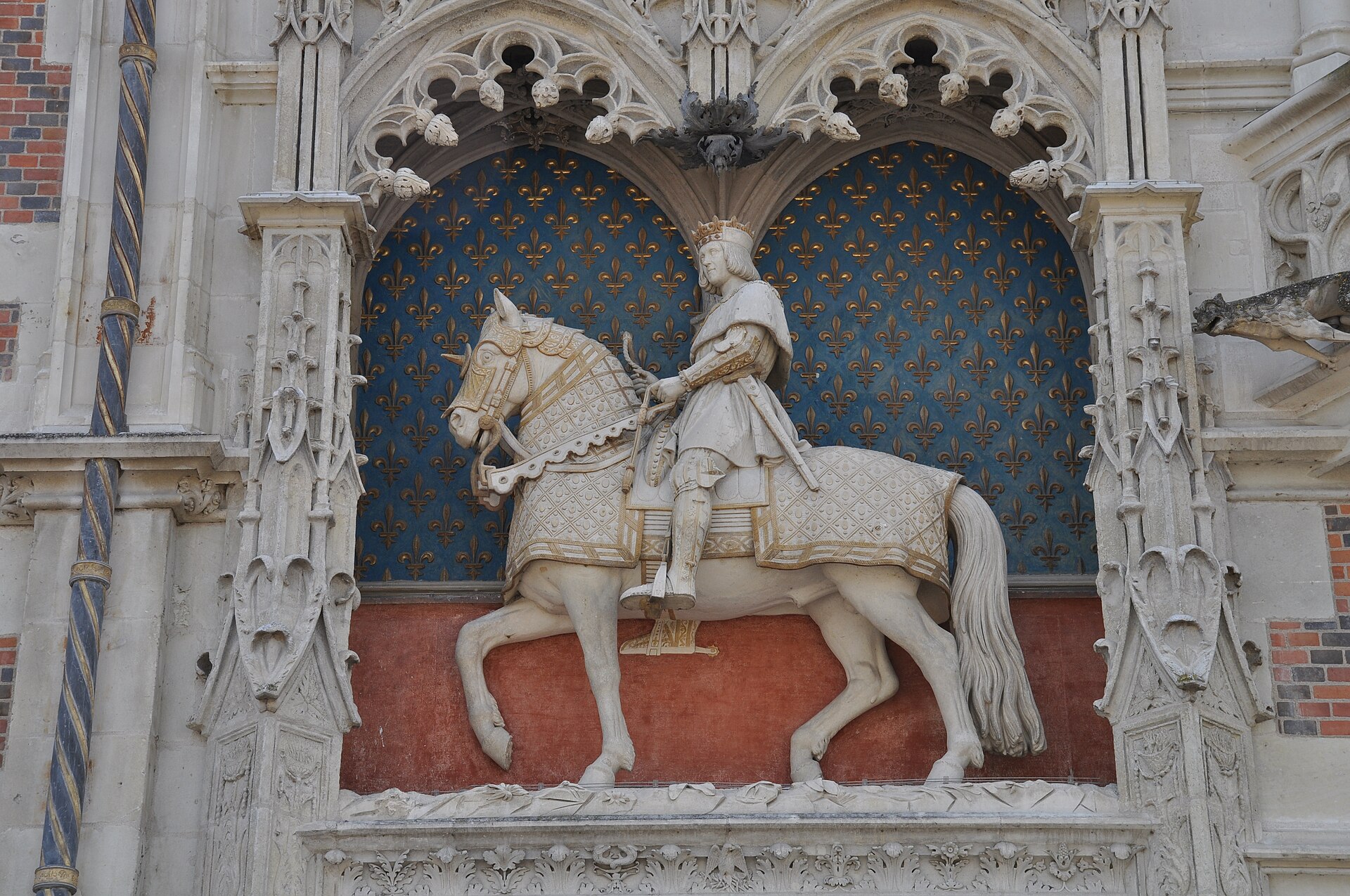 The equestrian statue of Louis XII above the entrance gateway