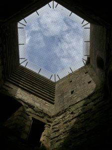 One of Bodiam's great round corner towers, still rising to its full height above the water