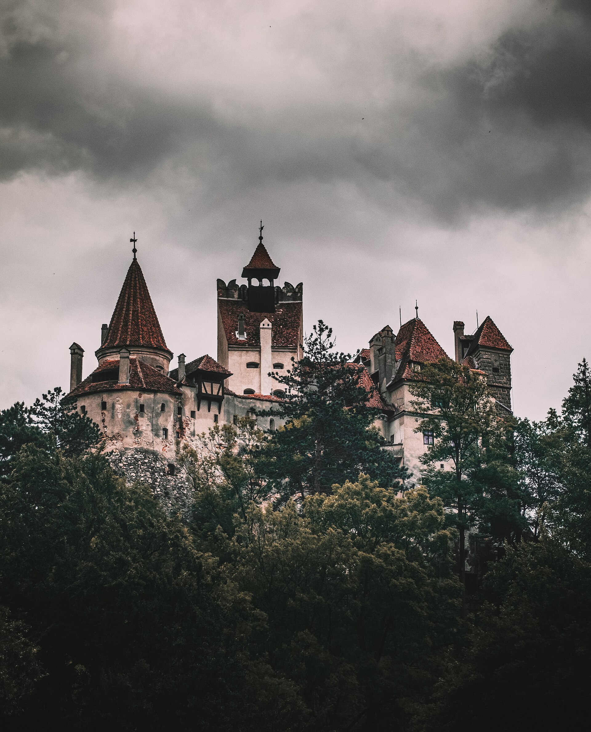 Under gathering cloud, the castle plays up its gothic image for the millions drawn by the Dracula legend.