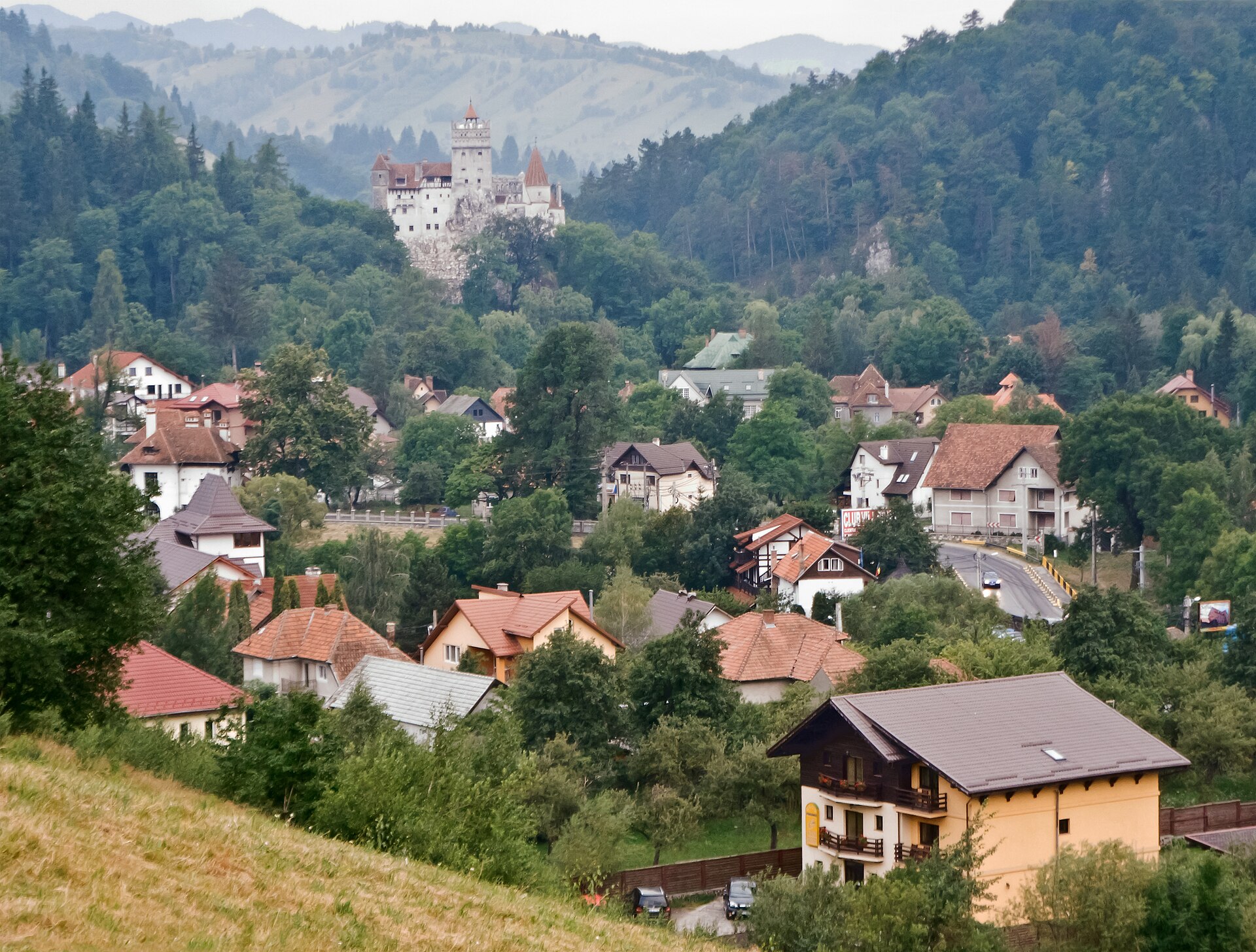 Bran Castle rises above its mountain pass, known worldwide, if inaccurately, as the home of Dracula.