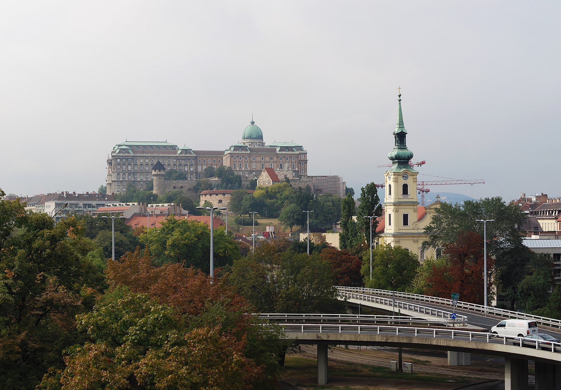 Buda Castle floodlit above the river at night