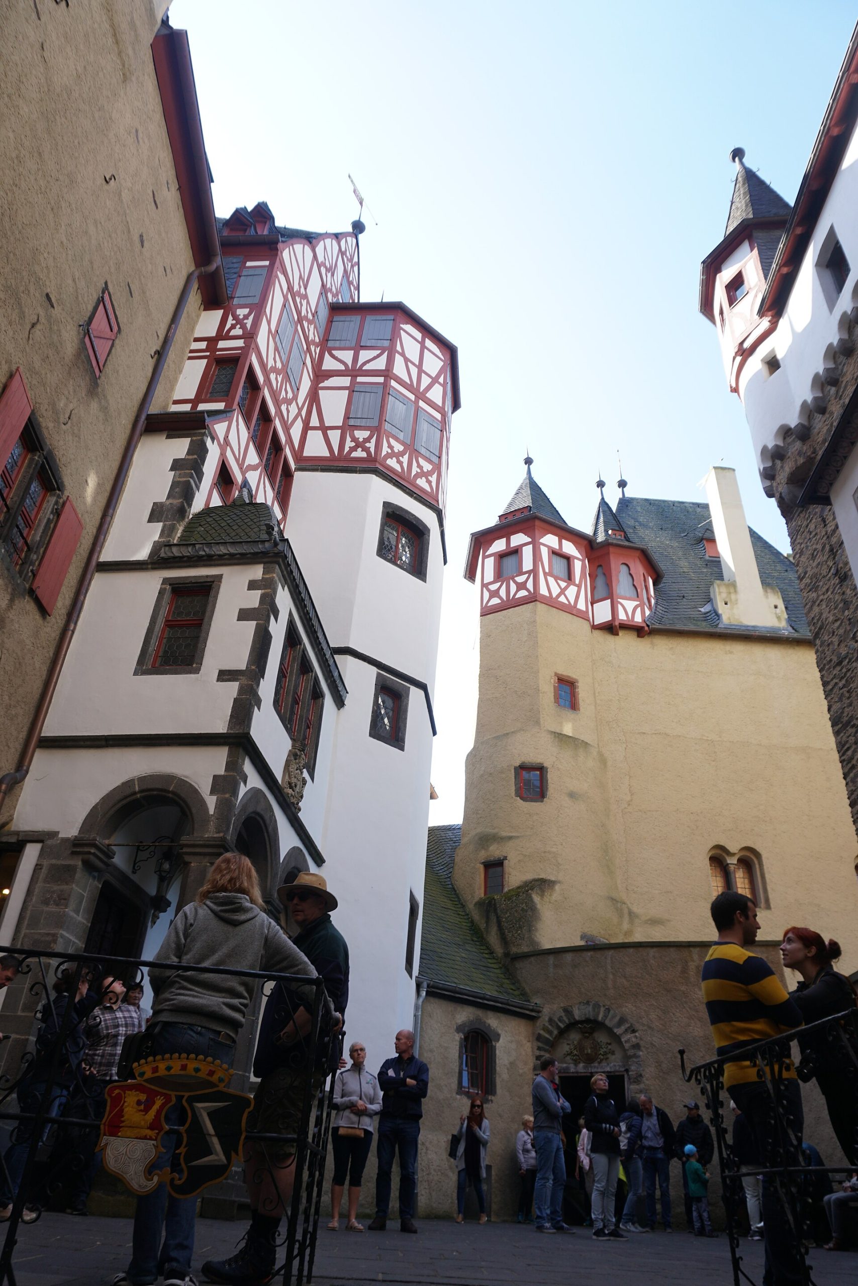 Oriel windows, turrets and timber framing crowd the courtyard walls