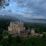 Burg Eltz rising through the morning mist of the Elzbach valley